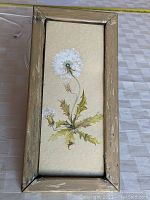 Full view of the framed watercolor and gouache painting showing the entire dandelion artwork and antique oak frame.