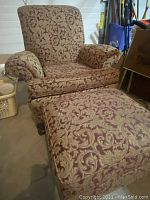 Full view of armchair and matching ottoman showing fabric pattern and overall design.