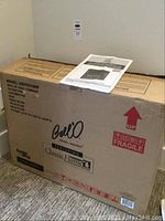Front view of sealed Bell'O ClassicFlame packaging with instruction manual on top