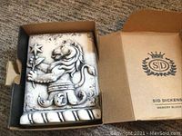Sid Dickens memory block "Leo" showing raised lion design inside original box.
