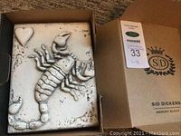 Memory block in original box showing raised Scorpion and heart design