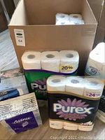 Bulk packages of toilet paper and tissues including Purex Ultra Comfort rolls, Cashmere Ultra Luxe jumbo rolls, Kleenex and Royale tissue packs