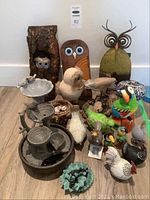 Overall group shot showing all bird and owl figurines plus multi-tier fountain