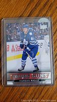 Front view of the 2013-14 Upper Deck Young Guns Morgan Rielly Rookie Card showing player image and card branding.