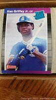 Close-up of Ken Griffey Jr. rookie baseball card showing front design and player image.