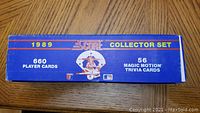 Blue collector set box showing text: '1989 Score Collector Set, 660 Player Cards, 56 Magic Motion Trivia Cards'.