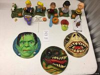 Top view of Peanuts Great Pumpkin figurines with pumpkins, sign, witch hat mask, candelabra, and Flight Force discs