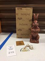 Jim Shore Yummy Bunny chocolate bunny figurine front view with original box, certificate card, and brand tag.