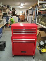 Full view of red Craftsman metal tool chest and rolling cabinet combo
