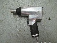 Side view of Chicago Pneumatic CP734H air wrench showing silver body and black grip with CP logo.