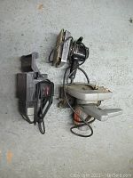 Top view of the two sanders and circular saw showing their general condition and size.