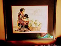 Framed watercolor painting showing Guatemalan woman with child and basket of produce