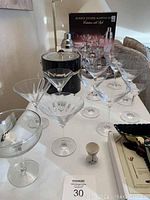 Full set displayed on table with four etched martini glasses, metal tray, and cocktail shaker. Box for martini set shown behind.