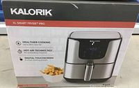 Front of box showing Kalorik XL Smart Fryer Pro packaging with brand name, model line, and key features