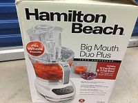 Box of Hamilton Beach Big Mouth Duo Plus food processor showing product name, features, and images.