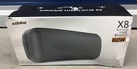 Box for xdobo X8 Bluetooth 60 watt speaker showing branding and key features.