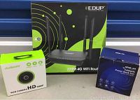 Photo showing all three boxed items: EDUP 4G WiFi router, AUSDOM HD 1080P web camera, OPOLAR foldable power bank fan