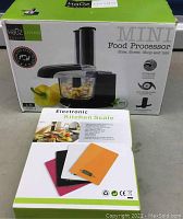 Photo of HaOZ Living Mini Food Processor box and electronic kitchen scale box with multiple color options.