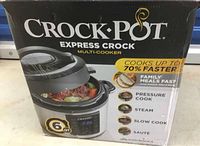 Box front showing Crock-Pot Express Crock Multi-Cooker 6QT with cooking modes and sealing functions.
