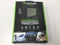 Front of box showing product name, features including waterproof, mountable, brightness 50W, 2.5 hours usage time, and built-in power bank battery.