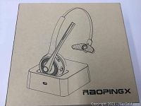 Box printed with illustration of Raopingx headset on charging dock