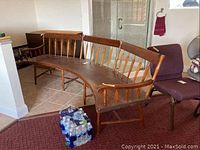 Full left-side view showing curved bench in room.