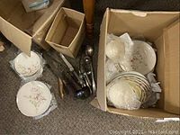 Boxed Fleetwood china dinner and side plates with floral pattern and flatware beside box, showing condition and quantity.