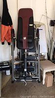 Full front view of inversion table upright in garage