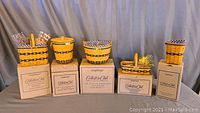 Full set of five miniature Longaberger baskets including original boxes and sachets shown inside some baskets.