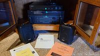 Stacked Soundcraftsmen amplifier, tuner, preamp with KLH speakers and documentation