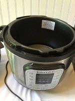 Instant Pot base unit with visible wear on rim where inner pot insert would normally sit