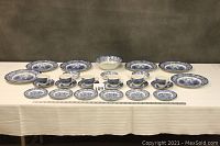 Full overview of all dishes on table with lot number