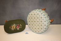 Top and side view of the oval and round vintage footstools, showing fabric and leg details.