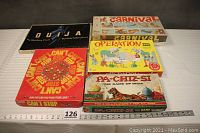 All five vintage games displayed in original boxes, showing overall condition and box artwork.