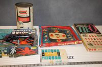 Photo showing five vintage boxed games together on table: Giant Double Hi-Q, Orville the Octopus, Disney's Toon-a-Vision, Thrift Banking Game, and Remco Science Kit.