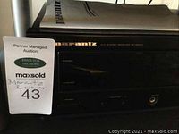Front left view of Marantz stereo receiver with auction tag
