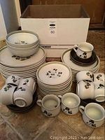 Overall view of all plates, bowls, and mugs grouped together
