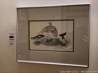 Framed Sue Coleman signed orca print hanging on wall, visible catalog number sticker.