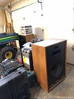 Full view of one Cornwall speaker in garage setting