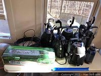 Full view of Chauvet controller box, six Titan PAR lights and cables on table