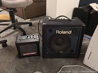 Both amplifiers front view showing Roland logos and speaker grilles