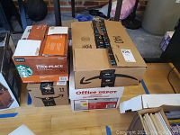 Sealed boxes containing multiple smaller boxes of CDs stacked for transport