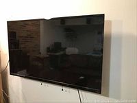 Front view of mounted television showing screen and bezel