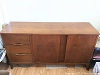 Front view of credenza showing overall design and condition