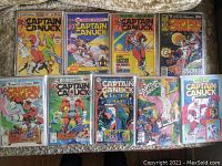 Full view of all 9 Captain Canuck comics laid out, including 8 Bronze Age series and 1 Captain Canuck Reborn #0