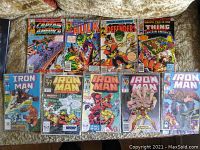 Lot of 10 vintage Marvel comic books spread out, showing a mix of Iron Man, Captain America, Hulk, Defenders, and Thing titles.