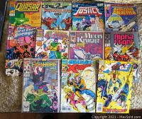 Lot of 11 vintage Marvel Comics, mixed titles from Bronze and Copper Age, laid out on a carpet. Shows front covers of all comics in lot.
