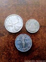 Image showing 1961 25 cent coin, 1968 10 cent coin, and 1945 Victory 5 cent coin