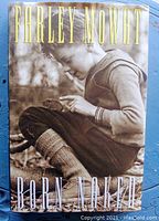 Front cover of Born Naked book showing child in outdoor setting with dust jacket.