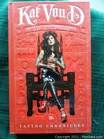 Image of the book front cover showing red embossed design and photo of Kat Von D